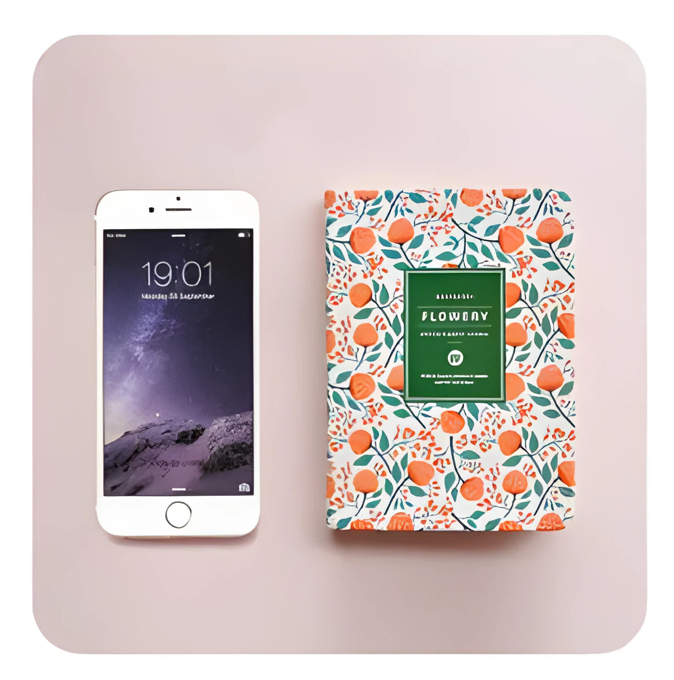 Green floral notepad with fabric imitation leather cover lying open on a table.
