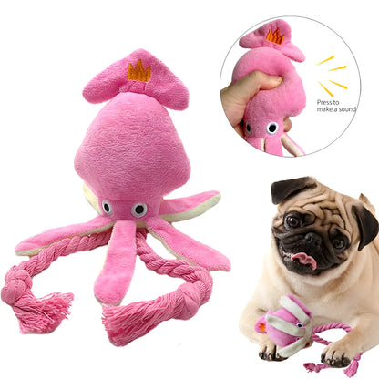 Pink squid-shaped corduroy plush dog toy with a squeaker.