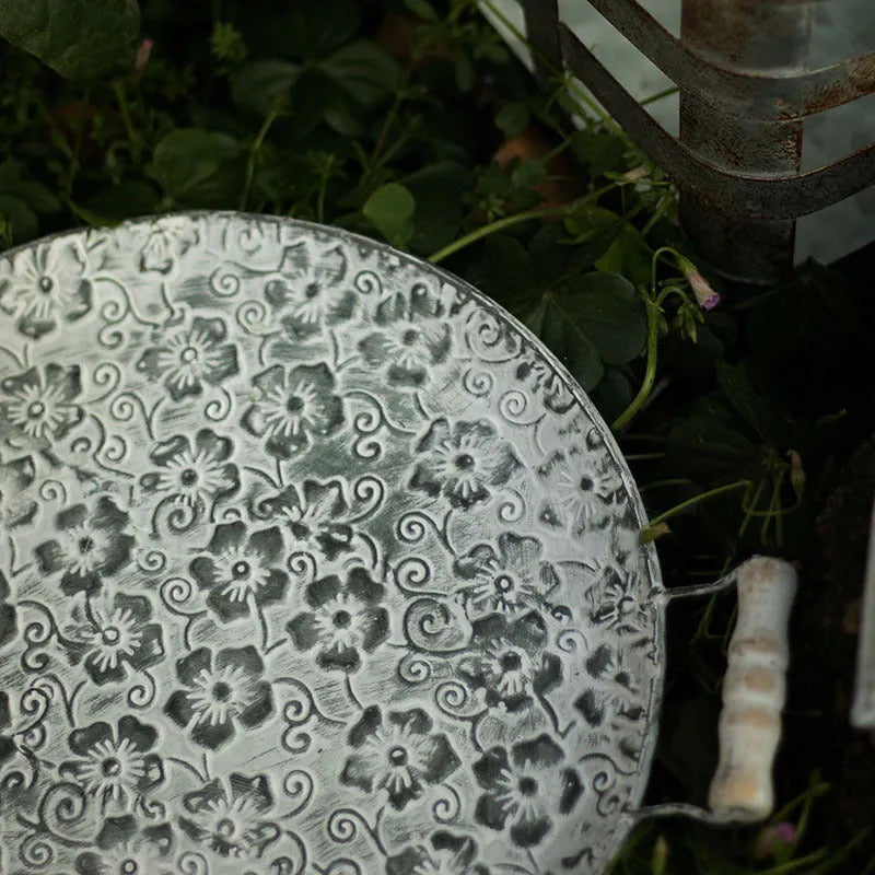 Round wrought iron storage tray in two sizes for organising jewellery or household items.