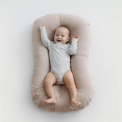 Portable baby nest crib in various colours, perfect for newborns to 3 years