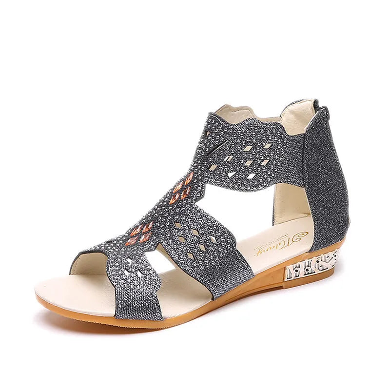 Women's black open toe flat sandals with rhinestone details and back zipper closure