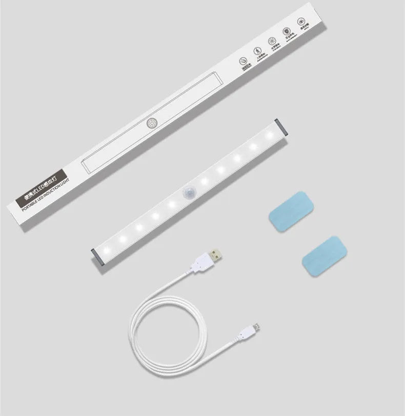 A matte aluminium LED closet light with a magnetic back, shown mounted inside a wooden wardrobe.