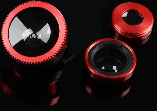 Three-in-one mobile phone camera lens kit showing fisheye, wide-angle, and macro lenses with universal clip in assorted colours.