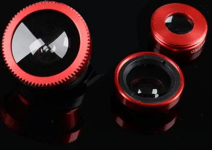 Three-in-one mobile phone camera lens kit showing fisheye, wide-angle, and macro lenses with universal clip in assorted colours.