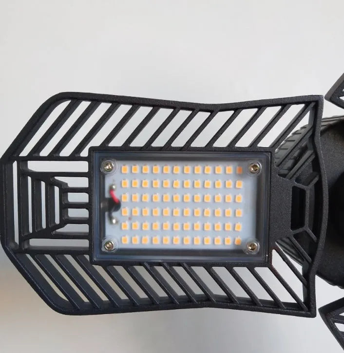 Industrial foldable waterproof LED garage lamp showing aluminium body and plastic casing.