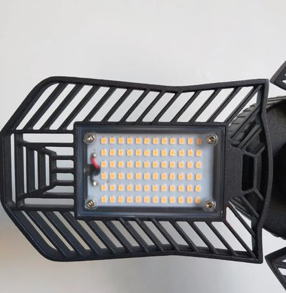 Industrial foldable waterproof LED garage lamp showing aluminium body and plastic casing.