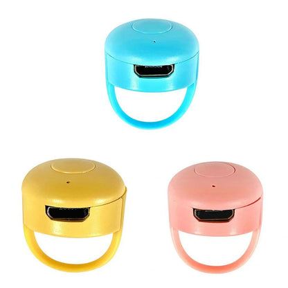 Bluetooth remote control ring for mobile phones in yellow, blue, and pink