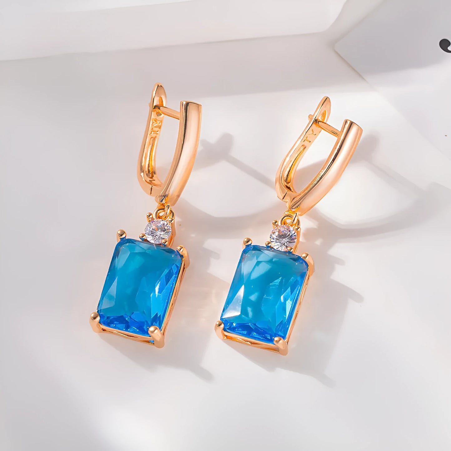 Square geometric earrings with gold electroplated finish on copper base