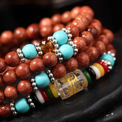 Women's golden star stone colour bracelet with 108 nugget sand pieces showing mantra text and fu character design