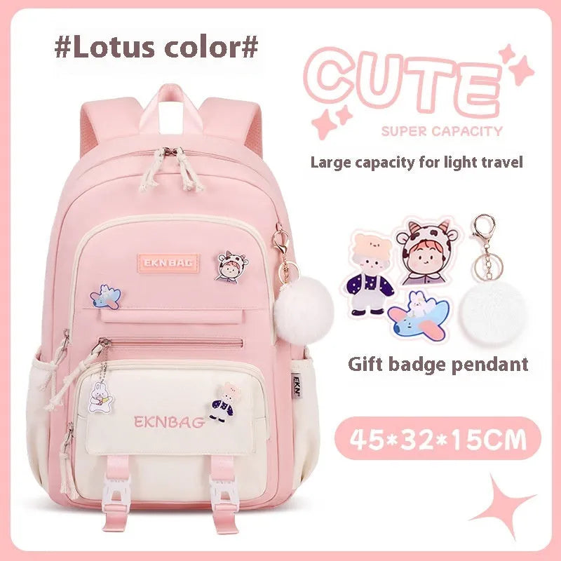 Pink girls school backpack with curved shoulder straps on a wooden floor