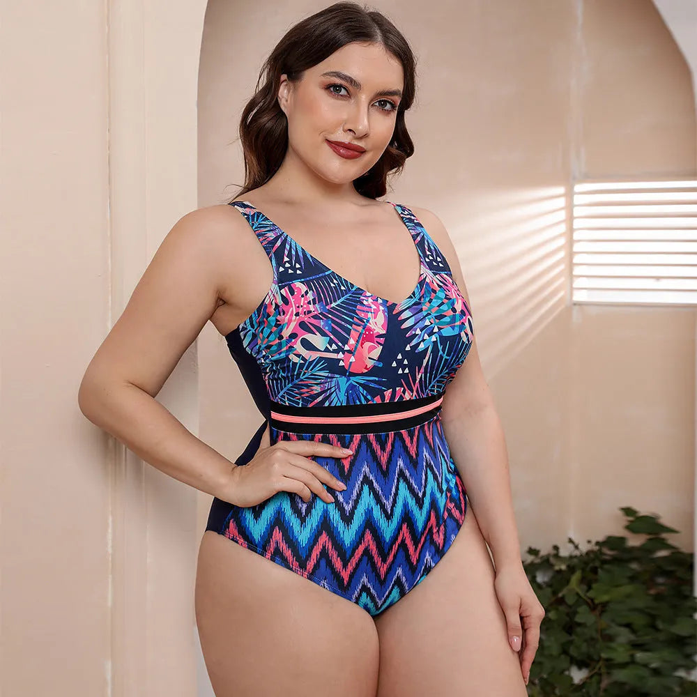 Blue and white printed women's one-piece swimsuit with spaghetti straps and a striped vest design.