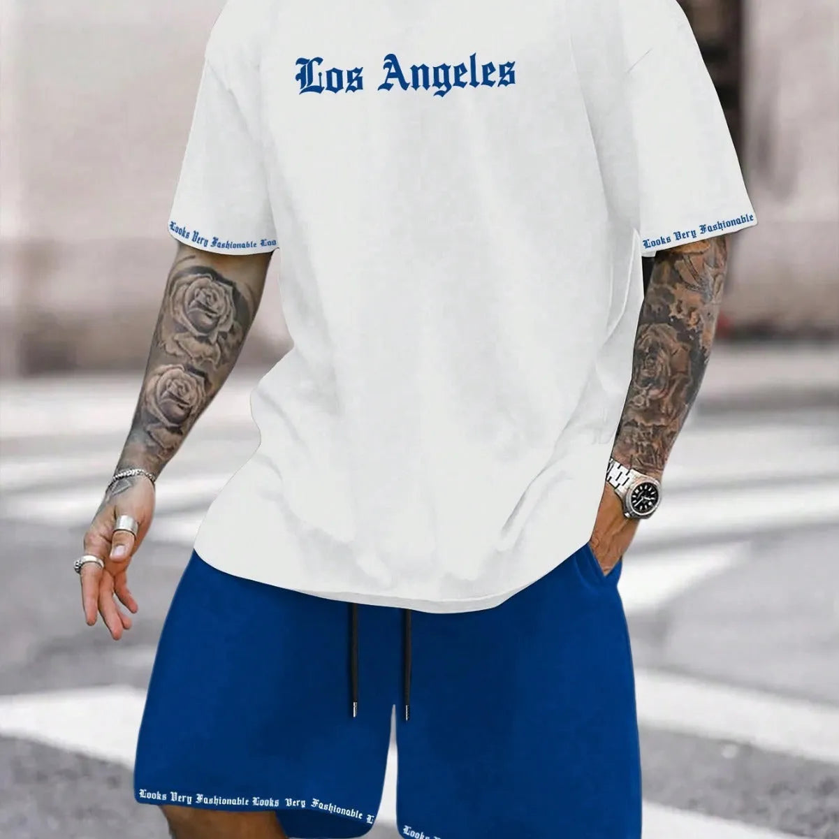 Man wearing a printed short-sleeve sports top and matching shorts in a quick-dry polyester blend.