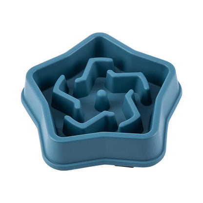Yellow plastic slow feeding dog bowl with raised obstacles at base to prevent choking