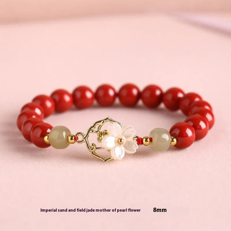 Handcrafted cinnabar bracelet with Hetian jade elements and lotus motifs in New Chinese style showing purple gold sand and emperor sandstone colour options