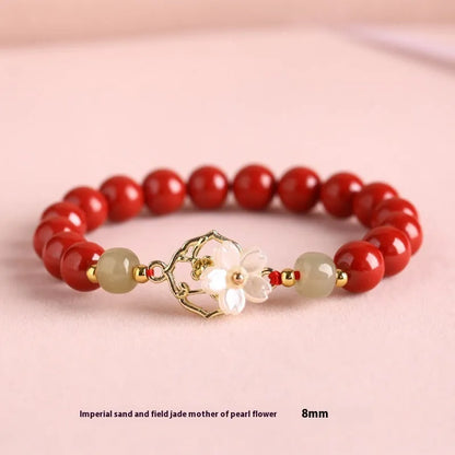 Handcrafted cinnabar bracelet with Hetian jade elements and lotus motifs in New Chinese style showing purple gold sand and emperor sandstone colour options