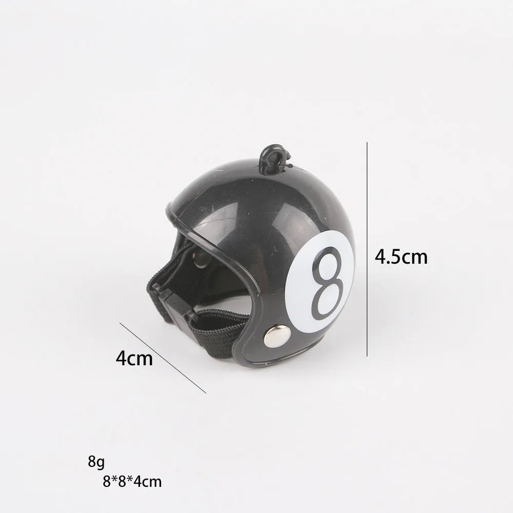 Small hard plastic helmet with elastic straps and sponge lining, designed for a chicken or bird to wear.