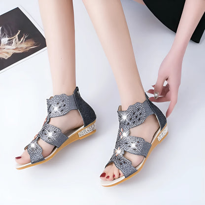 Women's black open toe flat sandals with rhinestone details and back zipper closure