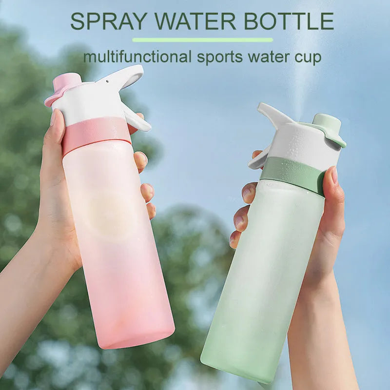 White spray water bottle with black leakproof lid and handle strap on a table
