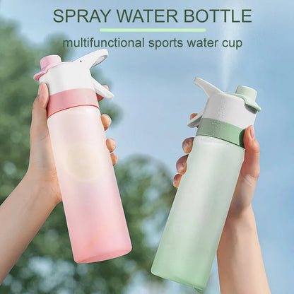 White spray water bottle with black leakproof lid and handle strap on a table