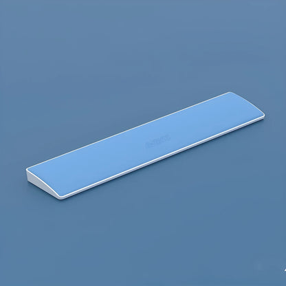 Black gaming keyboard wrist rest for a 104-key mechanical keyboard on a desk