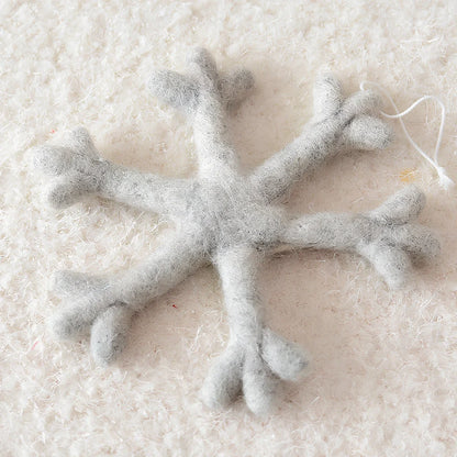 19cm wool felt snowflake and 13cm star Christmas decorations with intricate cut-out patterns