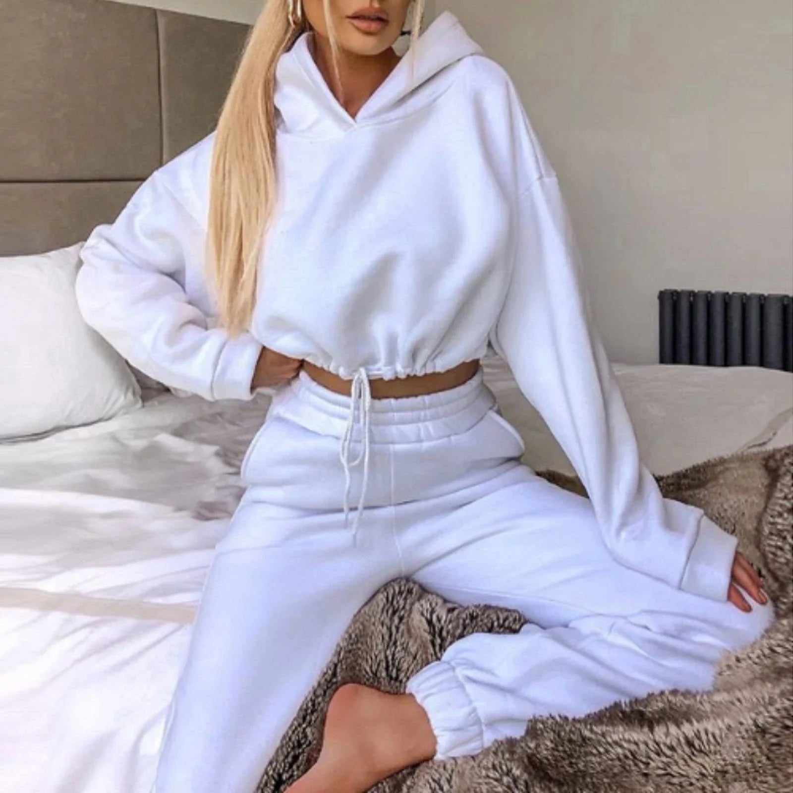 Stylish 2-piece athleisure sets for women in a variety of vibrant colors, including pink, purple, black, blue, and more.