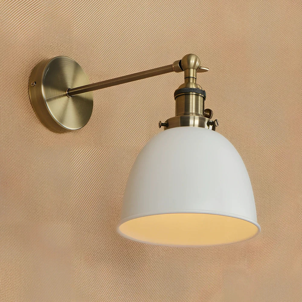 Bedroom wall light with 15cm wide iron shade in pink colour, mounted 20cm projection for soft illumination