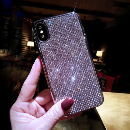 Silver full diamond silicone phone case for iPhone, showing camera and button cut-outs.