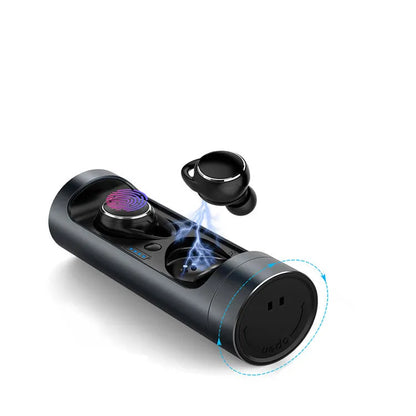 Dark Grey wireless Bluetooth headset with charging bay on a table.