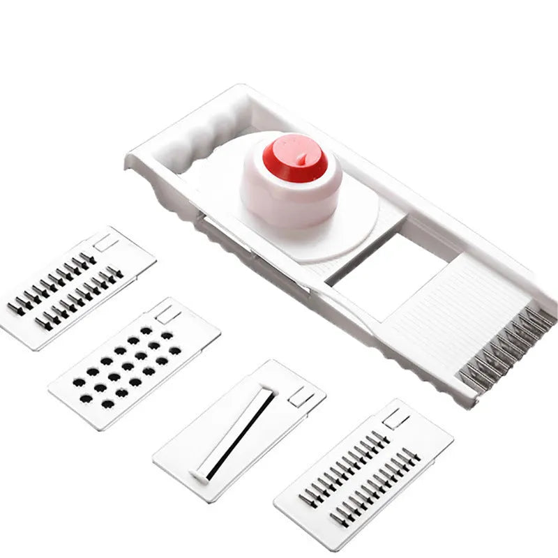 White five-piece stainless steel kitchen grater and vegetable slicer set with plastic hand guard