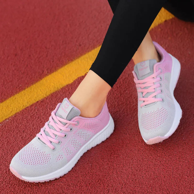 Women's white high-top trainers with cross-bind belt and hollow-out design on black background