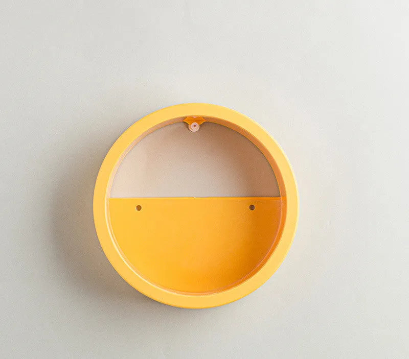 Round iron style plastic wall vase hanging basket for flowers in multiple colour options.