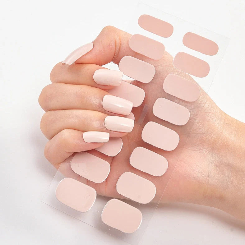 Nail art stickers with alphabet letters in sealed packaging, showing 16 designs per pack