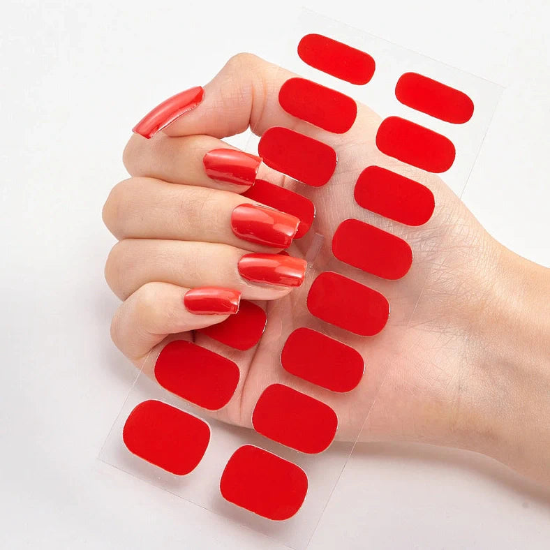 Nail art stickers with alphabet letters in sealed packaging, showing 16 designs per pack