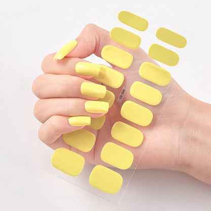Nail art stickers with alphabet letters in sealed packaging, showing 16 designs per pack