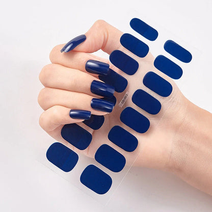 Nail art stickers with alphabet letters in sealed packaging, showing 16 designs per pack