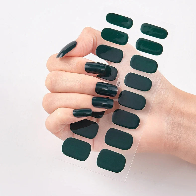 Nail art stickers with alphabet letters in sealed packaging, showing 16 designs per pack