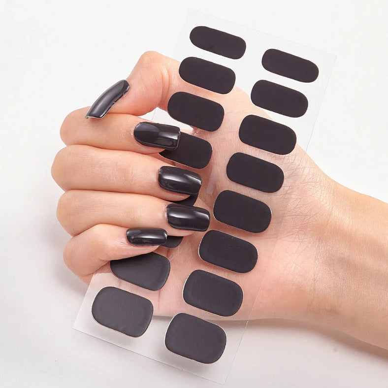 Nail art stickers with alphabet letters in sealed packaging, showing 16 designs per pack