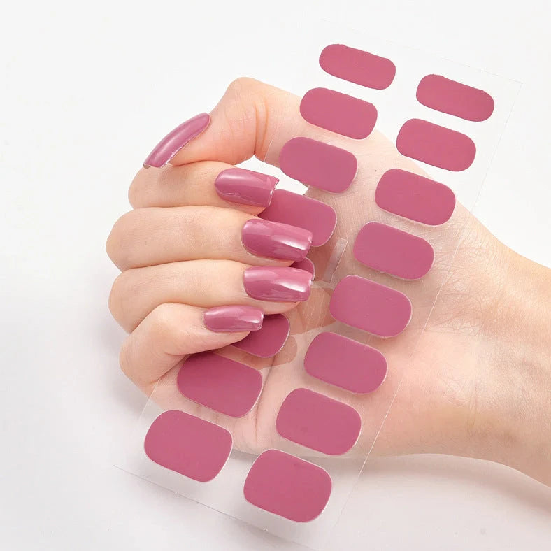 Nail art stickers with alphabet letters in sealed packaging, showing 16 designs per pack