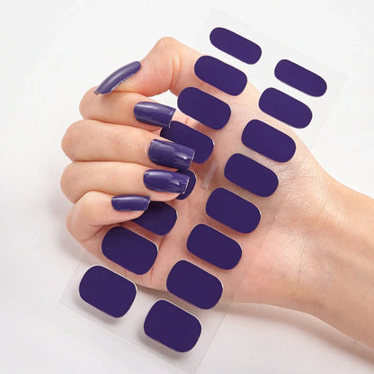 Nail art stickers with alphabet letters in sealed packaging, showing 16 designs per pack