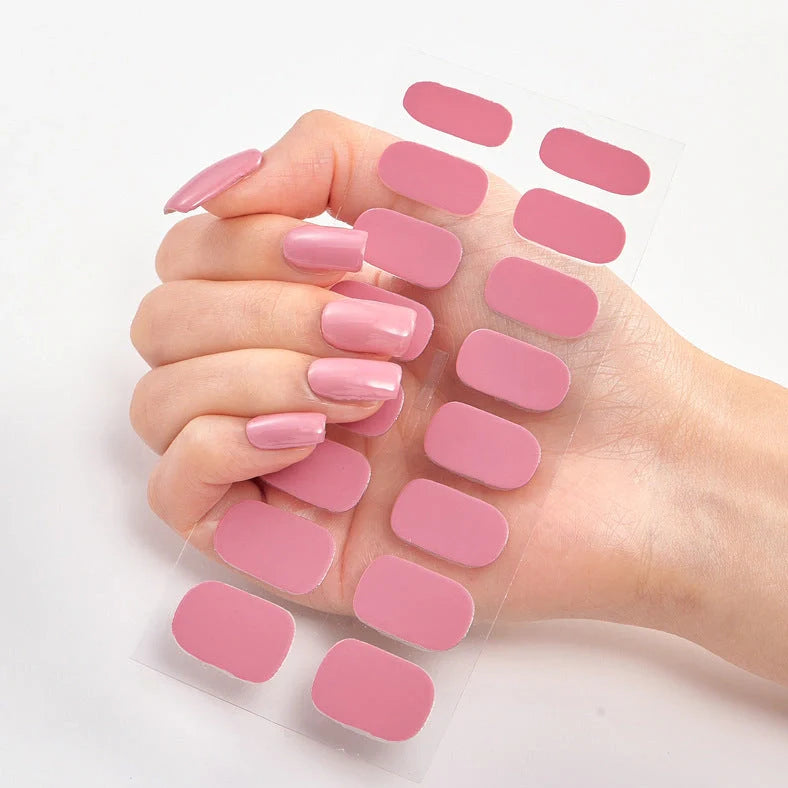 Nail art stickers with alphabet letters in sealed packaging, showing 16 designs per pack