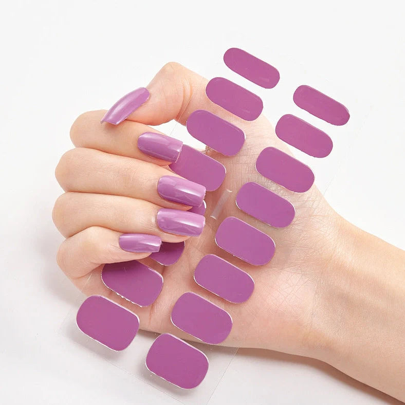 Nail art stickers with alphabet letters in sealed packaging, showing 16 designs per pack