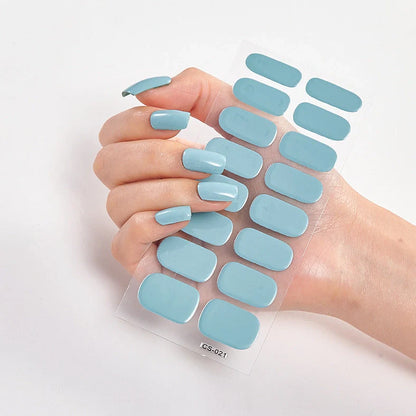 Nail art stickers with alphabet letters in sealed packaging, showing 16 designs per pack