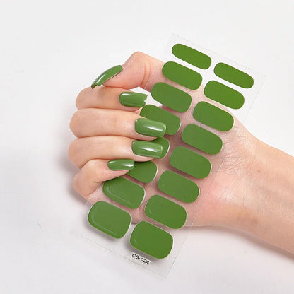 Nail art stickers with alphabet letters in sealed packaging, showing 16 designs per pack