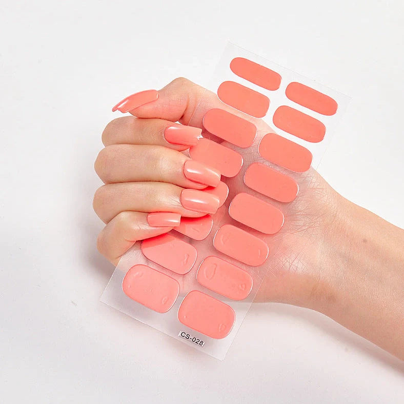 Nail art stickers with alphabet letters in sealed packaging, showing 16 designs per pack