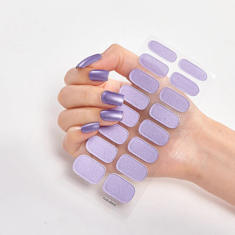 Nail art stickers with alphabet letters in sealed packaging, showing 16 designs per pack