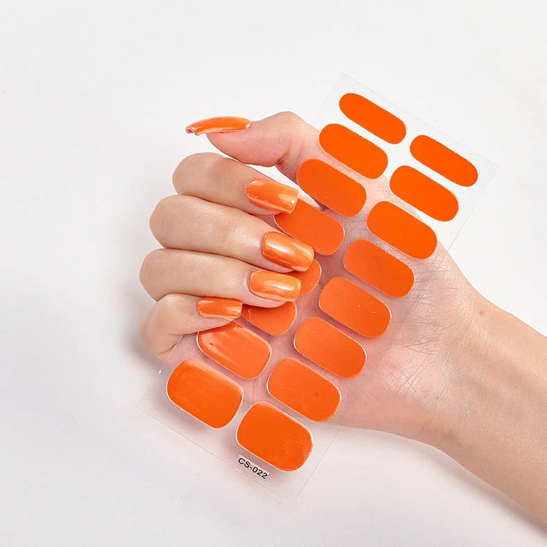 Nail art stickers with alphabet letters in sealed packaging, showing 16 designs per pack