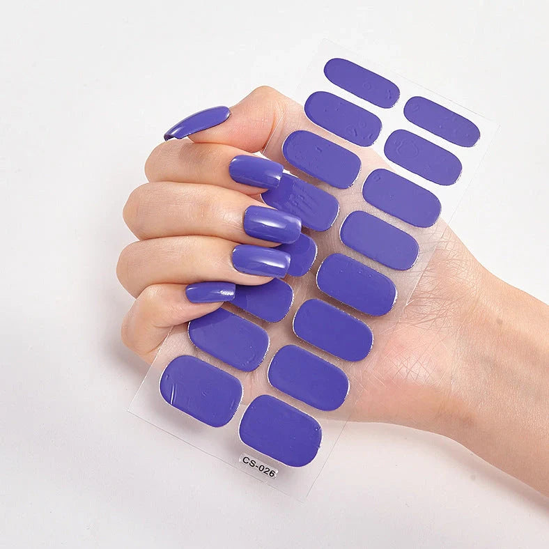 Nail art stickers with alphabet letters in sealed packaging, showing 16 designs per pack