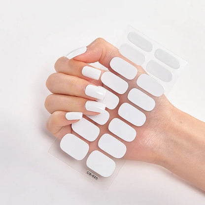 Nail art stickers with alphabet letters in sealed packaging, showing 16 designs per pack