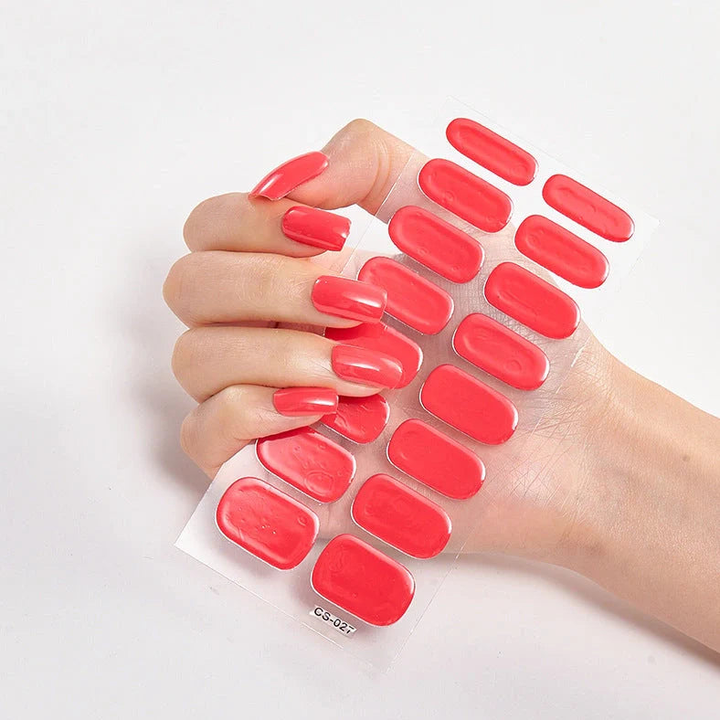 Nail art stickers with alphabet letters in sealed packaging, showing 16 designs per pack